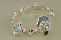jewelry shown in international jewelry fairs and and exhibitions, bracelet handcrafted and made by artist, bracelets sold in art and craft galleries, mixed metal handcrafted jewelry, bracelet made from silver and gold, gregory pyra piro handcrafted bracelet 8040