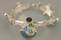 jewelry shown in international jewelry fairs and and exhibitions, bracelet handcrafted and made by artist, bracelets sold in art and craft galleries, mixed metal handcrafted jewelry, bracelet made from silver and gold, gregory pyra piro handcrafted bracelet 8040
