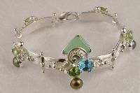 jewelry shown in international jewelry fairs and and exhibitions, bracelet handcrafted and made by artist, bracelets sold in art and craft galleries, mixed metal handcrafted jewelry, bracelet made from silver and gold, gregory pyra piro handcrafted bracelet 2940