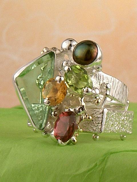 jewelry with semi precious stones, jewelry that has solid 14 karat gold, facet cut gemstones in jewelry, gregory pyra piro cyber ring 20202, one of a kind handcrafted ring made by artist, cyber rings for women with citrine and peridot, cyber rings for women with garnet and peridot, cyber rings for women with citrine and garnet, cyber ring made from silver and gold, silver and gold jewelry for women, luxury goods and jewelry for mature women, luxury jewelry for women, where to buy jewelry and gifts from my mother, silver and gold jewelry with gemstones for women, gold and silver jewelry with natural pearls and gemstones, retro style jewelry for women, jewellery shown in international fairs