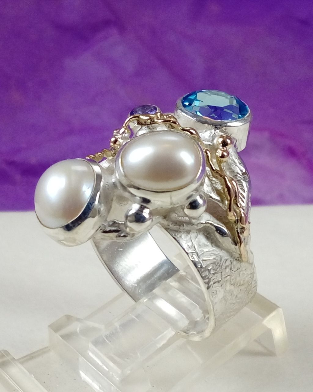 natural pearl and gemstone handcrafted jewelry, silver jewelry with color stones, contemporary jewellery collectible, fine jewellery with gemstones for aucitons, art jewelry with facet cut gemstones and natural pearls, contemporary jewelry with real stones, contemporary jewelry made by artist, Gregory Pyra Piro ring 7320, jewelry with amethyst and blue topaz together, rings for women with topaz and pearl together, rings for women with amethyst and pearl together,jewellery artist in Europe, designer jewellery sold at auctions and art galleries, where to find auctions with fine art and designer jewellery, bidding on auctions with designer jewellery, rings for women with amethyst and blutopaz, rings sold in art and craft galleries