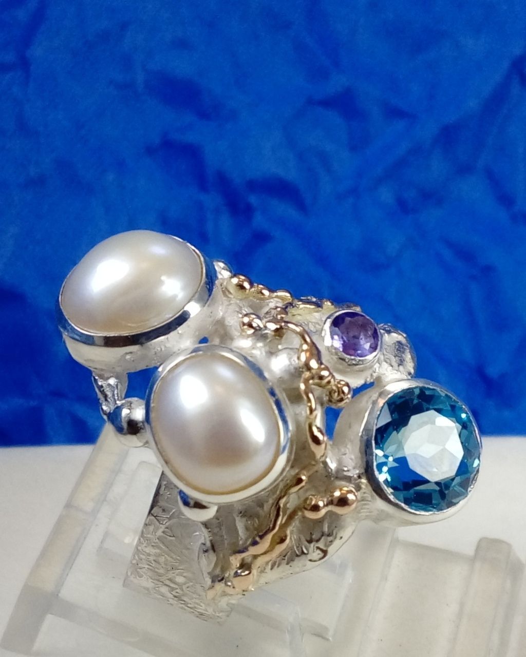 natural pearl and gemstone handcrafted jewelry, silver jewelry with color stones, contemporary jewellery collectible, fine jewellery with gemstones for aucitons, art jewelry with facet cut gemstones and natural pearls, contemporary jewelry with real stones, contemporary jewelry made by artist, Gregory Pyra Piro ring 7320, jewelry with amethyst and blue topaz together, rings for women with topaz and pearl together, rings for women with amethyst and pearl together,jewellery artist in Europe, designer jewellery sold at auctions and art galleries, where to find auctions with fine art and designer jewellery, bidding on auctions with designer jewellery, rings for women with amethyst and blutopaz, rings sold in art and craft galleries