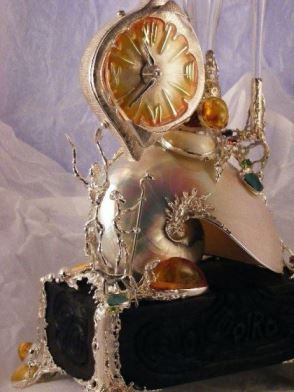 Gregory Pyra Piro Clock Sculpture in Oakwood, Sterling Silver, 14 Karat Gold, and Enamel with Nautilus Shell, Drusy, Amber, Facet Cut Garnet, Facet Cut Peridot, and Pearls
