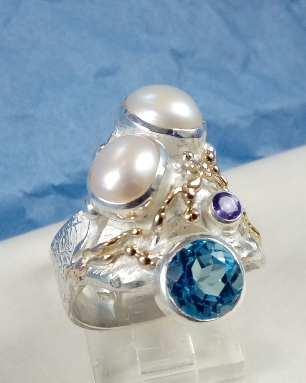 natural pearl and gemstone handcrafted jewelry, silver jewelry with color stones, contemporary jewellery collectible, fine jewellery with gemstones for aucitons, art jewelry with facet cut gemstones and natural pearls, contemporary jewelry with real stones, contemporary jewelry made by artist, Gregory Pyra Piro ring 7320, jewelry with amethyst and blue topaz together, ring with topaz and pearl together, ring with amethyst and pearl together,jewellery artist in Europe, designer jewellery sold at auctions and art galleries, where to find auctions with fine art and designer jewellery, bidding on auctions with designer jewellery, ring with amethyst and blutopaz, rings sold in art and craft galleries