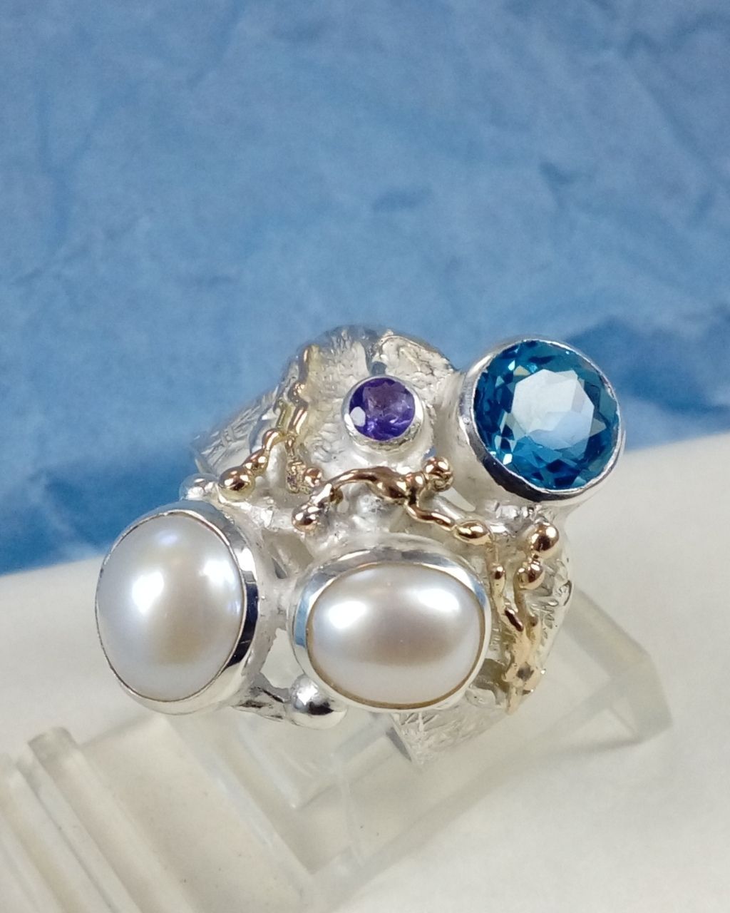 natural pearl and gemstone handcrafted jewelry, silver jewelry with color stones, contemporary jewellery collectible, fine jewellery with gemstones for aucitons, art jewelry with facet cut gemstones and natural pearls, contemporary jewelry with real stones, contemporary jewelry made by artist, Gregory Pyra Piro ring 7320, jewelry with amethyst and blue topaz together, ring with topaz and pearl together, ring with amethyst and pearl together,jewellery artist in Europe, designer jewellery sold at auctions and art galleries, where to find auctions with fine art and designer jewellery, bidding on auctions with designer jewellery, ring with amethyst and blutopaz, rings sold in art and craft galleries