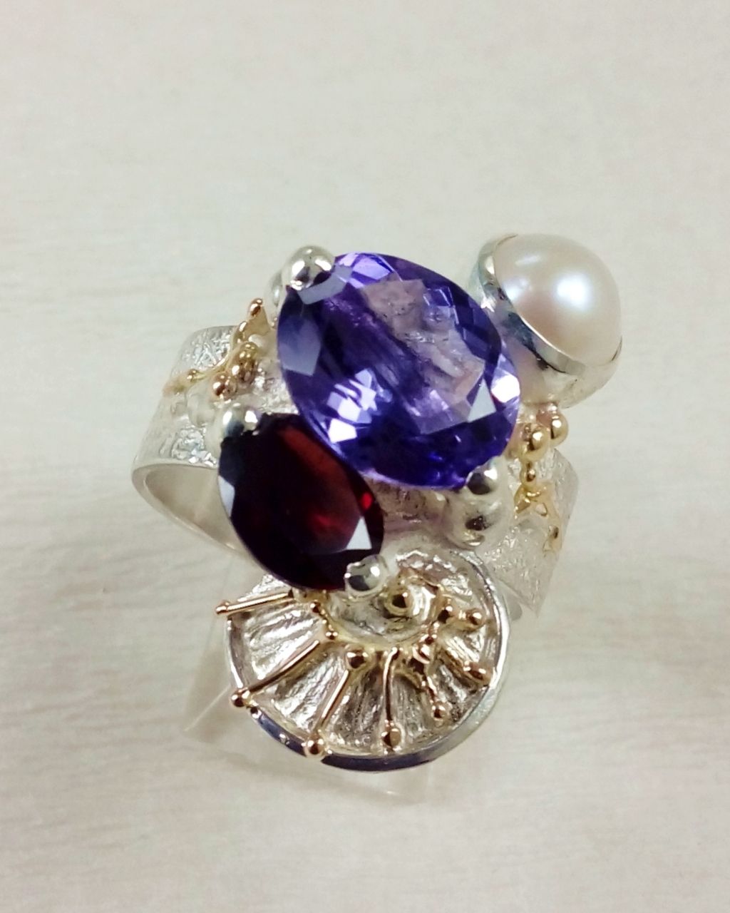 Gregory Pyra Piro ring 3035, Gregory Pyra Piro art jewellery, art nouveau inspired art, one of a kind jewellery with amethyst and garnet, handcrafted jewellery with gemstones and pearls, who still makes one of a kind jewelry, jewellery sold in art galleries, jewellery sold in craft galleries, mixed metal jewellery with gemstones and pearls, artists during lockdown, where do I find still active vintage jewelry artists, how do I find vinatage designers and artists that are still active, where tojewelry with retro style for my grandmotherjewellery online, where to find vintage jewelry artist that is still active, where to find fine craft product styles from the 80s and 90s, buy fine craft online, rings made during lockdown