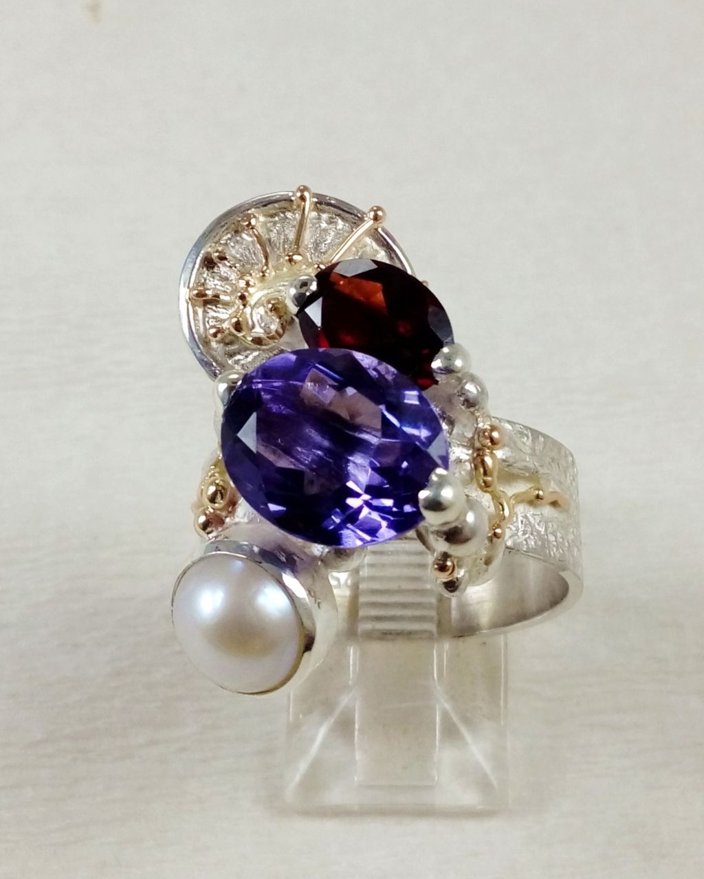 Gregory Pyra Piro ring 3035, Gregory Pyra Piro art jewellery, art nouveau inspired art, one of a kind jewellery with amethyst and garnet, handcrafted jewellery with gemstones and pearls, who still makes one of a kind jewelry, jewellery sold in art galleries, jewellery sold in craft galleries, mixed metal jewellery with gemstones and pearls, artists during lockdown, where do I find still active vintage jewelry artists, how do I find vinatage designers and artists that are still active, where tojewelry with retro style for my grandmotherjewellery online, where to find vintage jewelry artist that is still active, where to find fine craft product styles from the 80s and 90s, buy fine craft online, rings made during lockdown