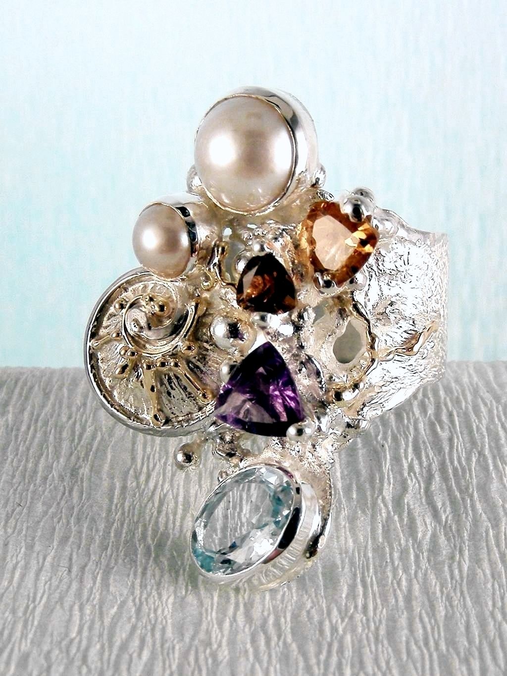 wearable art jewelry, jewelry to wear, jewelry made to orderGregory Pyra Piro ring 2050, rings for women with blue topaz and pink tourmaline, rings for women with amethyst and blue topaz, rings for women with pink tourmaline and pearl, rings for women with blue topaz and pearl, mixed metal rings in silver and gold, rings in art and craft galleries