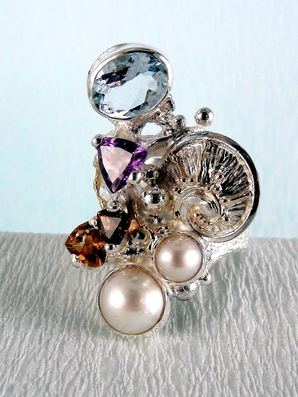 wearable art jewelry, jewelry to wear, jewelry made to orderGregory Pyra Piro ring 2050, rings for women with blue topaz and pink tourmaline, rings for women with amethyst and blue topaz, rings for women with pink tourmaline and pearl, rings for women with blue topaz and pearl, mixed metal rings in silver and gold, rings in art and craft galleries