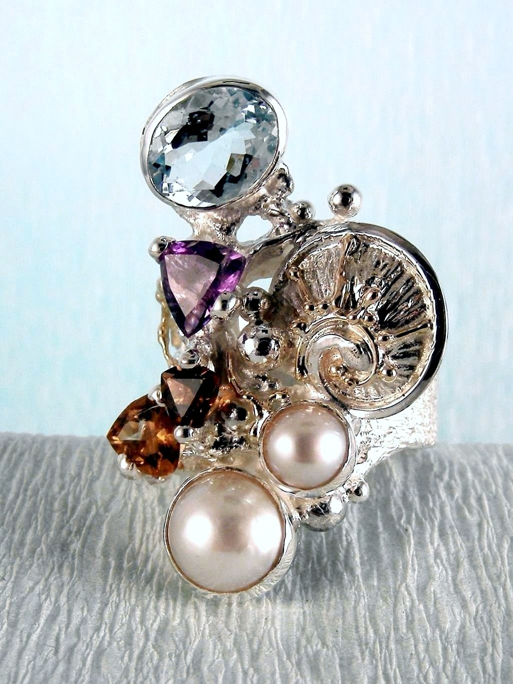 wearable art jewelry, jewelry to wear, jewelry made to orderGregory Pyra Piro ring 2050, rings for women with blue topaz and pink tourmaline, rings for women with amethyst and blue topaz, rings for women with pink tourmaline and pearl, rings for women with blue topaz and pearl, mixed metal rings in silver and gold, rings in art and craft galleries