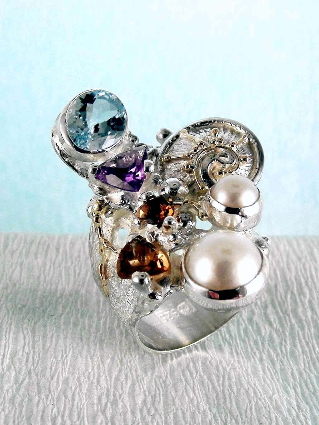 wearable art jewelry, jewelry to wear, jewelry made to orderGregory Pyra Piro ring 2050, rings for women with blue topaz and pink tourmaline, rings for women with amethyst and blue topaz, rings for women with pink tourmaline and pearl, rings for women with blue topaz and pearl, mixed metal rings in silver and gold, rings in art and craft galleries