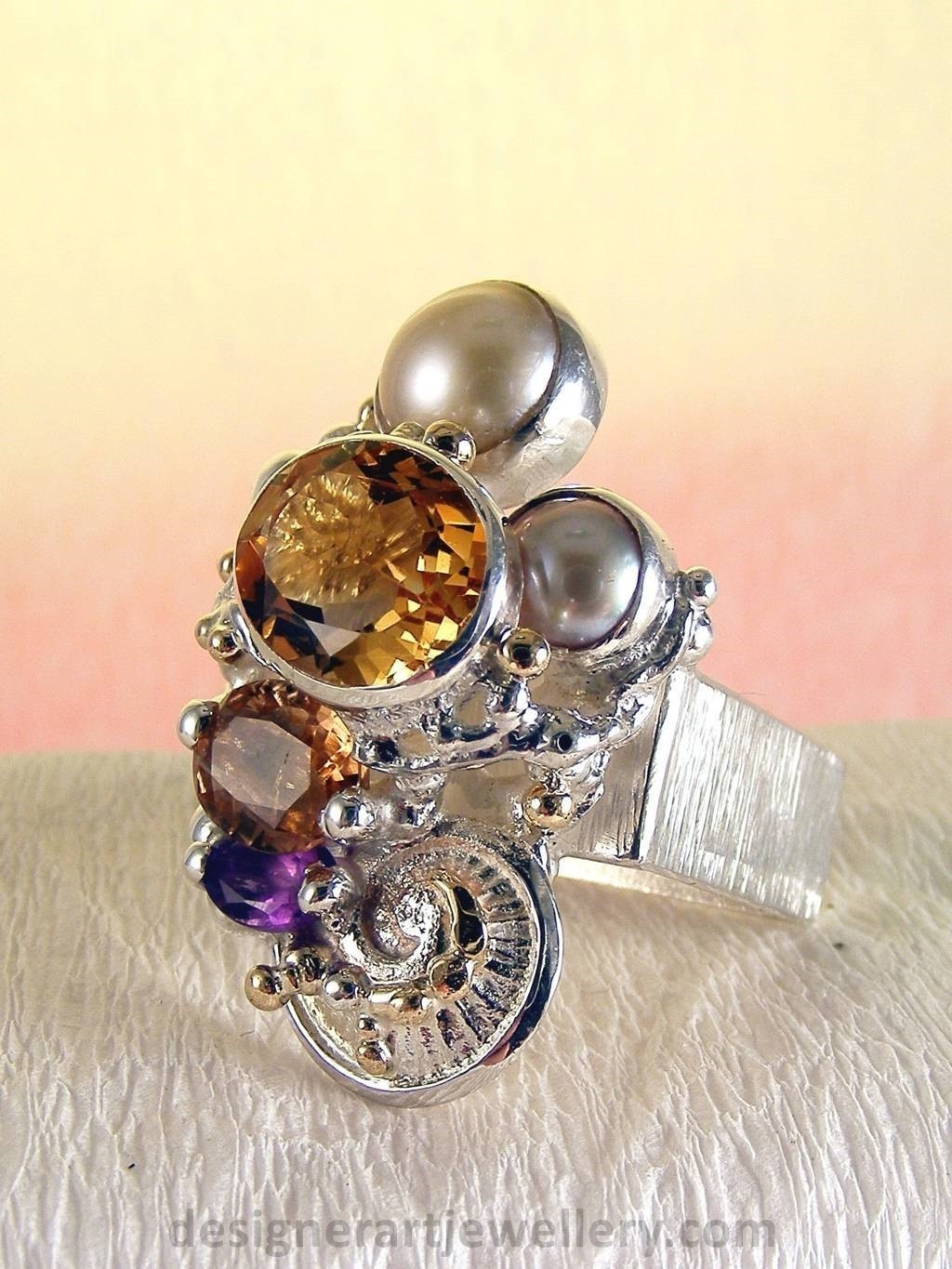 jewelry made from gold and silver, fashion inspired jewelry for women over 40, luxury jewelry shopping, handmade jewelry accessories for women over 50, fashion with elegance over 60 accessoreis and jewelry, jewelry with color stones, jewelry with real pearls, gregory pyra piro square ring 4291, handcrafted jewellery in art and craft galleries, mixed metal handcrafted ring, one of a kind ring in sterling silver and gold, rings for women with pink tourmaline and amethyst, rings for women with pink tourmaline and pearl, rings for women with citrine and pearl
