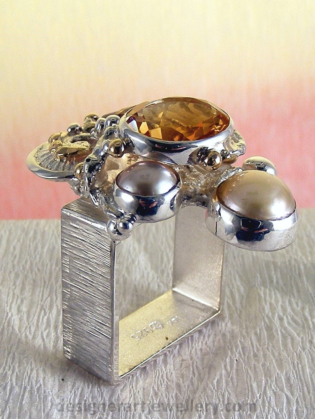 jewelry made from gold and silver, fashion inspired jewelry for women over 40, luxury jewelry shopping, handmade jewelry accessories for women over 50, fashion with elegance over 60 accessoreis and jewelry, jewelry with color stones, jewelry with real pearls, gregory pyra piro square ring 4291, handcrafted jewellery in art and craft galleries, mixed metal handcrafted ring, one of a kind ring in sterling silver and gold, rings for women with pink tourmaline and amethyst, rings for women with pink tourmaline and pearl, rings for women with citrine and pearl