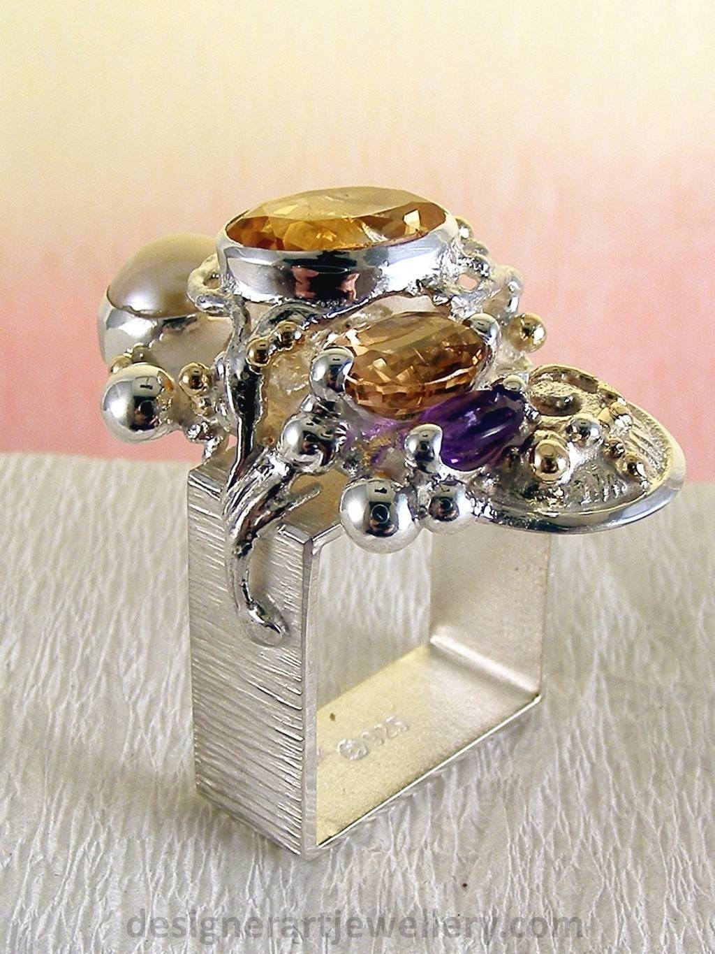 jewelry made from gold and silver, fashion inspired jewelry for women over 40, luxury jewelry shopping, handmade jewelry accessories for women over 50, fashion with elegance over 60 accessoreis and jewelry, jewelry with color stones, jewelry with real pearls, gregory pyra piro square ring 4291, handcrafted jewellery in art and craft galleries, mixed metal handcrafted ring, one of a kind ring in sterling silver and gold, rings for women with pink tourmaline and amethyst, rings for women with pink tourmaline and pearl, rings for women with citrine and pearl
