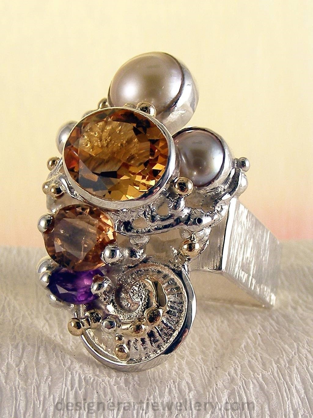jewelry made from gold and silver, fashion inspired jewelry for women over 40, luxury jewelry shopping, handmade jewelry accessories for women over 50, fashion with elegance over 60 accessoreis and jewelry, jewelry with color stones, jewelry with real pearls, gregory pyra piro square ring 4291, handcrafted jewellery in art and craft galleries, mixed metal handcrafted ring, one of a kind ring in sterling silver and gold, rings for women with pink tourmaline and amethyst, rings for women with pink tourmaline and pearl, rings for women with citrine and pearl