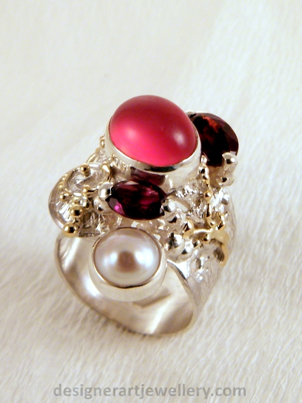 wearable art jewelry to wear, meticulously handcrafted jewelry, sterling silver and 14k gold jewelry with semi precious stones, jewelry to wear with luxury brands, jewellery to wear with luxury brands, jewellery to wear with fashion brands, jewellery to wear with brand bags, unique combinations with gemstones, contemporary jewelry with moonstone and pearl, art jewelry with facet cut garnet and pearl, sterling silver and 14 karat gold ring with facet cut garnet and pearl, unique design jewelry with pearl and moonstone, one of a kind jewellery, handmade artisan jewellery, mixed metal artisan jewellery, artisan jewellery with gemstones and pearls, gregory pyra piro band ring 5240