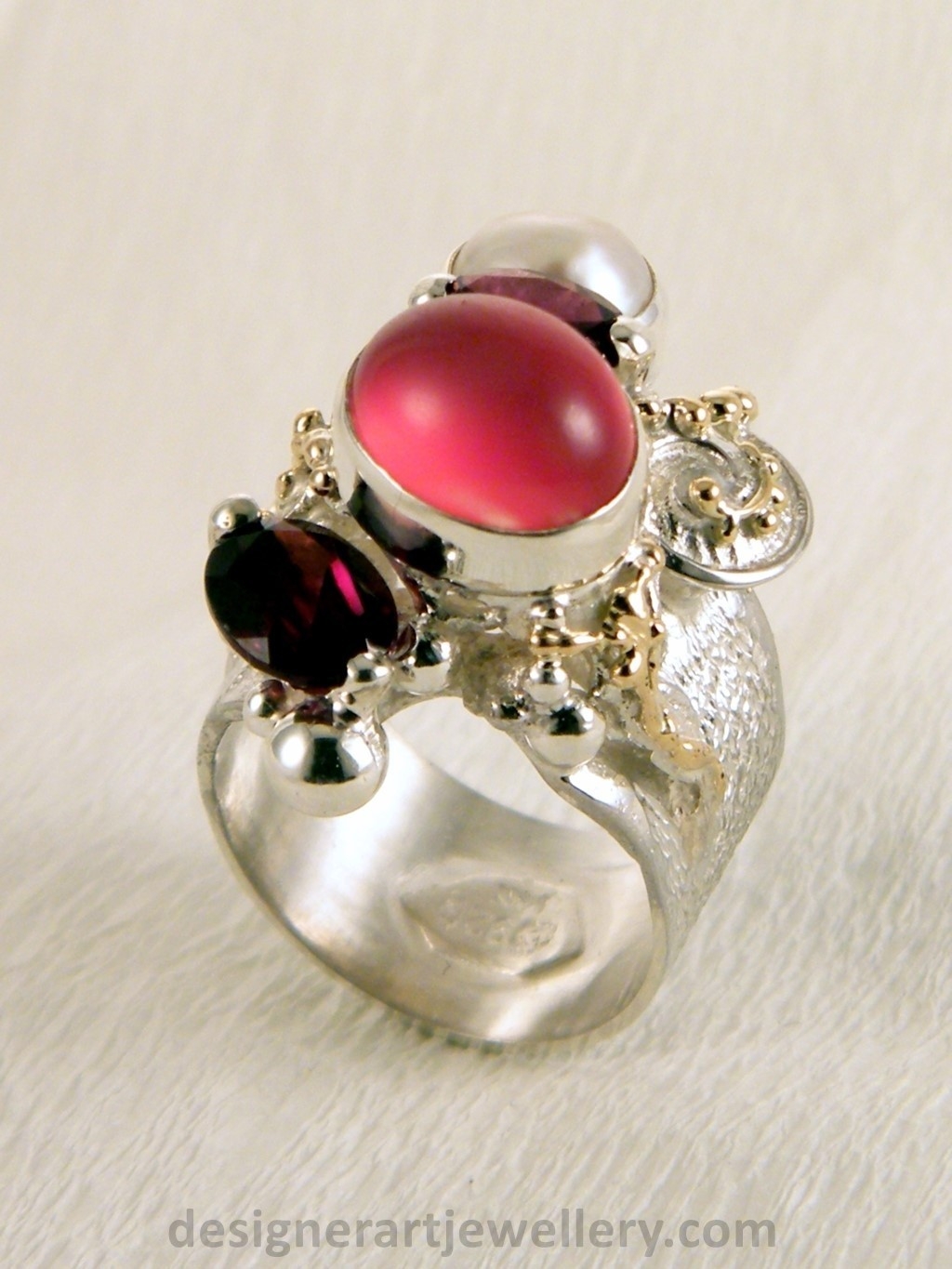 wearable art jewelry to wear, meticulously handcrafted jewelry, sterling silver and 14k gold jewelry with semi precious stones, jewelry to wear with luxury brands, jewellery to wear with luxury brands, jewellery to wear with fashion brands, jewellery to wear with brand bags, unique combinations with gemstones, contemporary jewelry with moonstone and pearl, art jewelry with facet cut garnet and pearl, sterling silver and 14 karat gold ring with facet cut garnet and pearl, unique design jewelry with pearl and moonstone, one of a kind jewellery, handmade artisan jewellery, mixed metal artisan jewellery, artisan jewellery with gemstones and pearls, gregory pyra piro band ring 5240