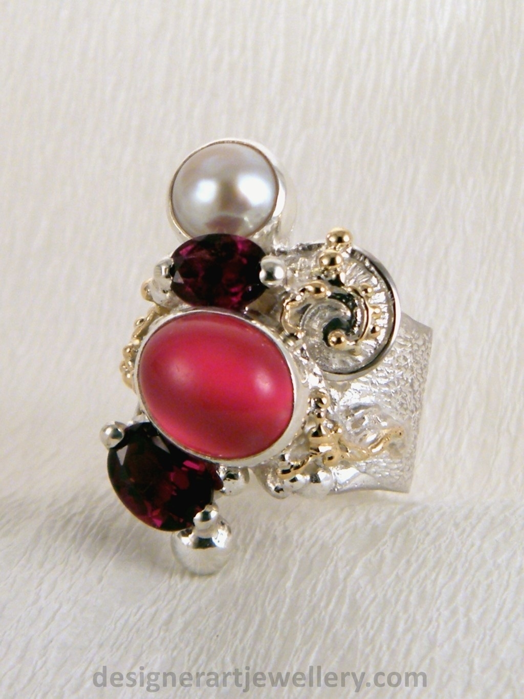 wearable art jewelry to wear, meticulously handcrafted jewelry, sterling silver and 14k gold jewelry with semi precious stones, jewelry to wear with luxury brands, jewellery to wear with luxury brands, jewellery to wear with fashion brands, jewellery to wear with brand bags, unique combinations with gemstones, contemporary jewelry with moonstone and pearl, art jewelry with facet cut garnet and pearl, sterling silver and 14 karat gold ring with facet cut garnet and pearl, unique design jewelry with pearl and moonstone, one of a kind jewellery, handmade artisan jewellery, mixed metal artisan jewellery, artisan jewellery with gemstones and pearls, gregory pyra piro band ring 5240