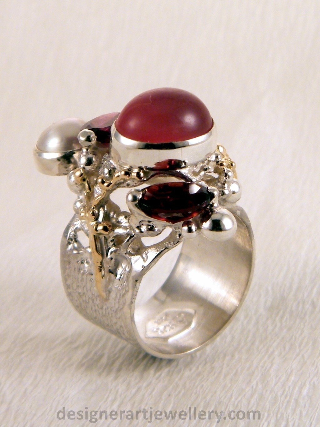 wearable art jewelry to wear, meticulously handcrafted jewelry, sterling silver and 14k gold jewelry with semi precious stones, jewelry to wear with luxury brands, jewellery to wear with luxury brands, jewellery to wear with fashion brands, jewellery to wear with brand bags, unique combinations with gemstones, contemporary jewelry with moonstone and pearl, art jewelry with facet cut garnet and pearl, sterling silver and 14 karat gold ring with facet cut garnet and pearl, unique design jewelry with pearl and moonstone, one of a kind jewellery, handmade artisan jewellery, mixed metal artisan jewellery, artisan jewellery with gemstones and pearls, gregory pyra piro band ring 5240