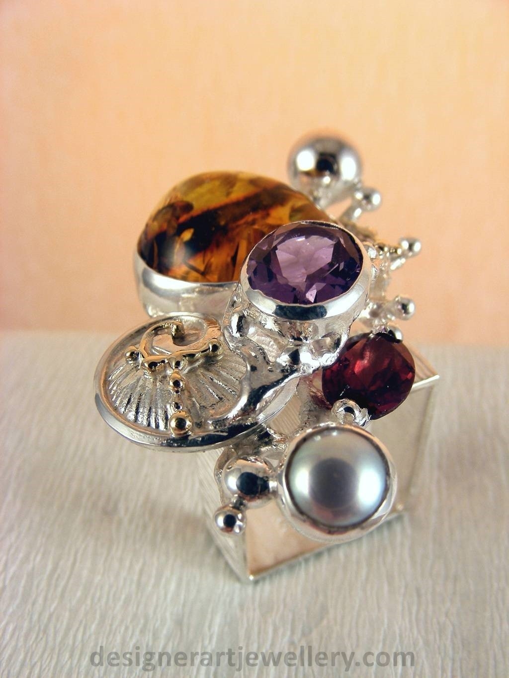 jewelry made from gold and silver, fashion inspired jewelry for women over 40, luxury jewelry shopping, handmade jewelry accessories for women over 50, fashion with elegance over 60 accessoreis and jewelry, jewelry with color stones, jewelry with real pearls, gregory pyra piro square ring 1710, handcrafted jewellery in art and craft galleries, mixed metal handcrafted ring, one of a kind ring in sterling silver and gold, rings for women with amber and amethyst, rings for women with garnet and amber, ring amber and pearl