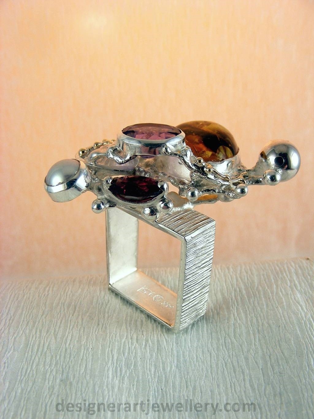jewelry made from gold and silver, fashion inspired jewelry for women over 40, luxury jewelry shopping, handmade jewelry accessories for women over 50, fashion with elegance over 60 accessoreis and jewelry, jewelry with color stones, jewelry with real pearls, gregory pyra piro square ring 1710, handcrafted jewellery in art and craft galleries, mixed metal handcrafted ring, one of a kind ring in sterling silver and gold, rings for women with amber and amethyst, rings for women with garnet and amber, ring amber and pearl