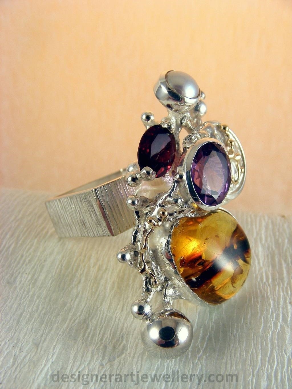 jewelry made from gold and silver, fashion inspired jewelry for women over 40, luxury jewelry shopping, handmade jewelry accessories for women over 50, fashion with elegance over 60 accessoreis and jewelry, jewelry with color stones, jewelry with real pearls, gregory pyra piro square ring 1710, handcrafted jewellery in art and craft galleries, mixed metal handcrafted ring, one of a kind ring in sterling silver and gold, rings for women with amber and amethyst, rings for women with garnet and amber, ring amber and pearl