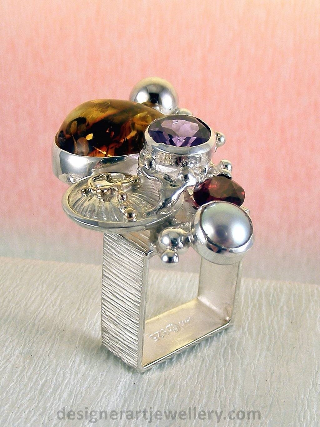 jewelry made from gold and silver, fashion inspired jewelry for women over 40, luxury jewelry shopping, handmade jewelry accessories for women over 50, fashion with elegance over 60 accessoreis and jewelry, jewelry with color stones, jewelry with real pearls, gregory pyra piro square ring 1710, handcrafted jewellery in art and craft galleries, mixed metal handcrafted ring, one of a kind ring in sterling silver and gold, rings for women with amber and amethyst, rings for women with garnet and amber, ring amber and pearl