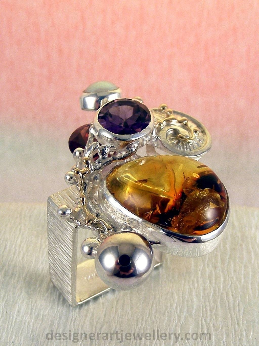 jewelry made from gold and silver, fashion inspired jewelry for women over 40, luxury jewelry shopping, handmade jewelry accessories for women over 50, fashion with elegance over 60 accessoreis and jewelry, jewelry with color stones, jewelry with real pearls, gregory pyra piro square ring 1710, handcrafted jewellery in art and craft galleries, mixed metal handcrafted ring, one of a kind ring in sterling silver and gold, rings for women with amber and amethyst, rings for women with garnet and amber, ring amber and pearl